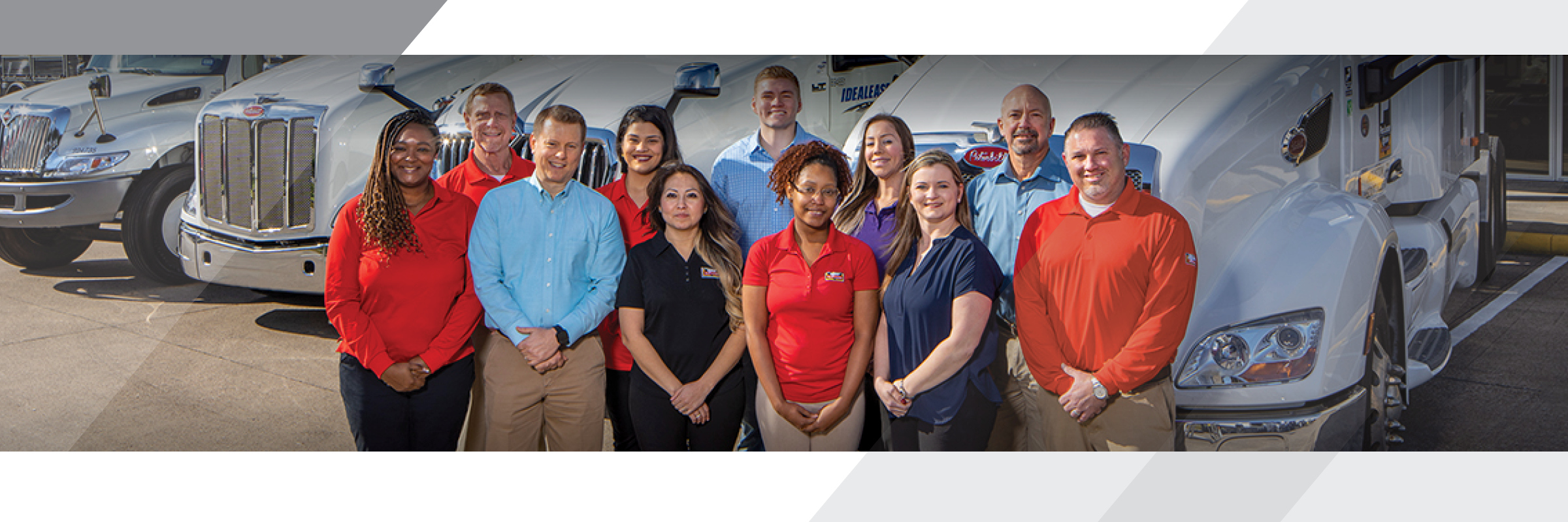 Group of Rush Truck Leasing employees in front of trucks